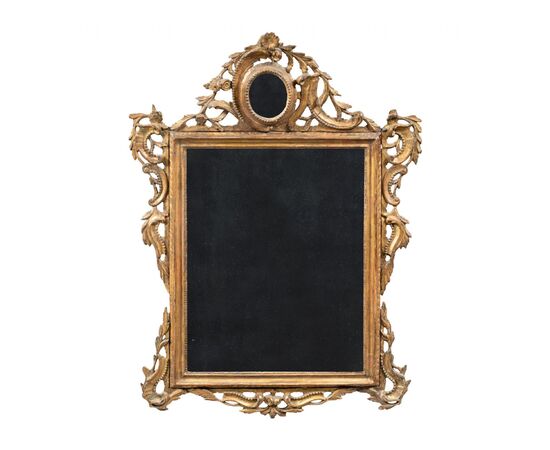 Carved and gilded wooden mirror. Venice, 18th century.