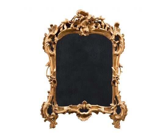 Carved and gilded wooden mirror. Venice, 18th century.