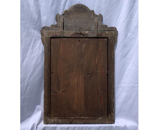 Lacquered, gilded, and painted wooden mirror. Venice, 18th-19th century.