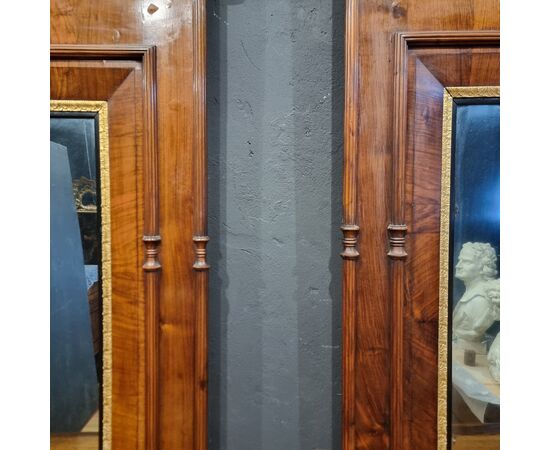 Coppia di consolles in noce Carlo X 1820 con specchiere
