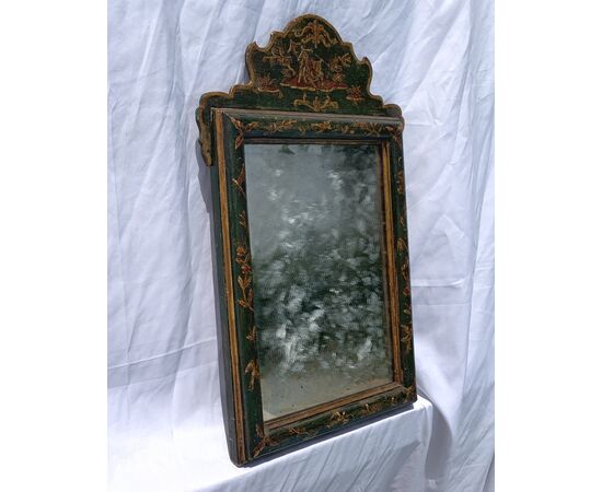 Lacquered, gilded, and painted wooden mirror. Venice, 18th-19th century.
