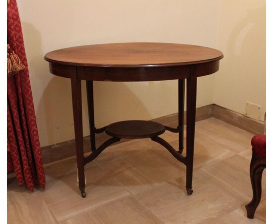 Oval coffee table with four tapered legs