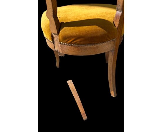 Four walnut chairs carved with rocaille motifs.