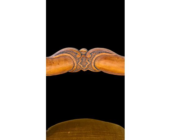 Four walnut chairs carved with rocaille motifs.