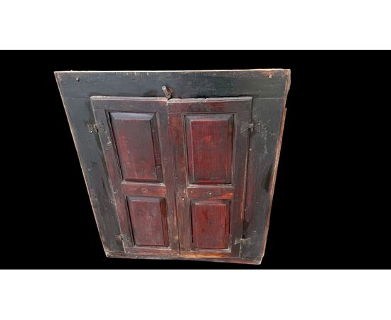 Two-door wall-mounted walnut cabinet.