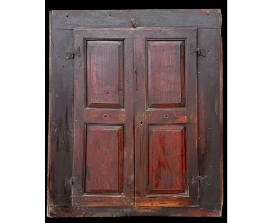 Two-door wall-mounted walnut cabinet.