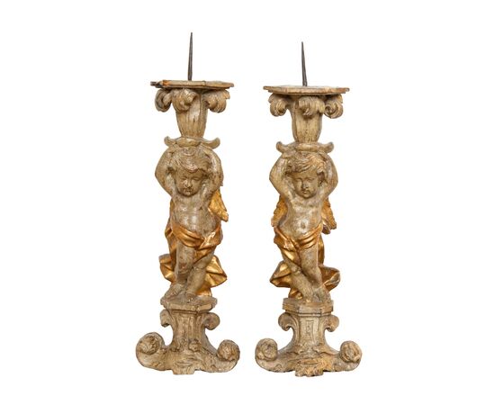 Pair of candle-holding putti