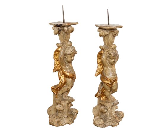 Pair of candle-holding putti