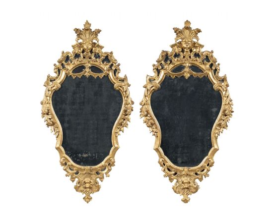 Pair of carved and gilded wooden mirrors. Italy, 18th century.