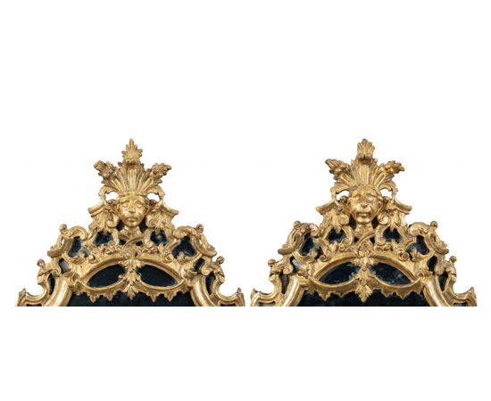 Pair of carved and gilded wooden mirrors. Italy, 18th century.