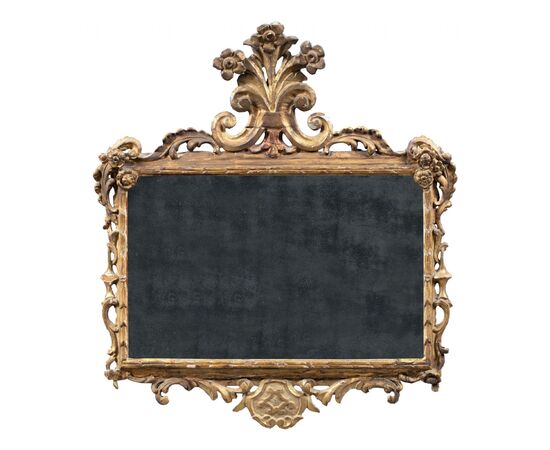 Carved and gilded wooden mirror. Italy, 18th century.