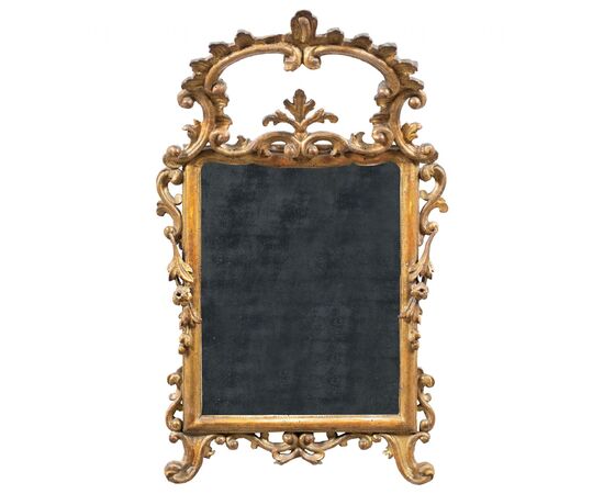 Carved and gilded wooden mirror. Italy, 18th century.