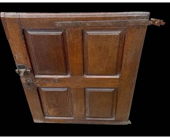 Carved walnut door panel with four panels.