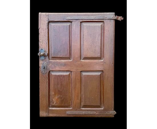Carved walnut door panel with four panels.