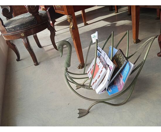 Painted metal log holder in the shape of a swan