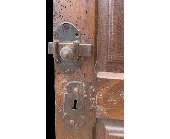 Carved walnut door panel with four panels.