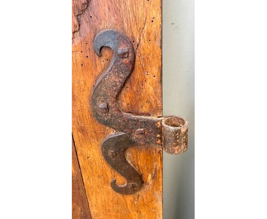 Pair of walnut doors with four engraved diamond panels.