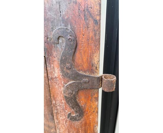 Pair of walnut doors with four engraved diamond panels.