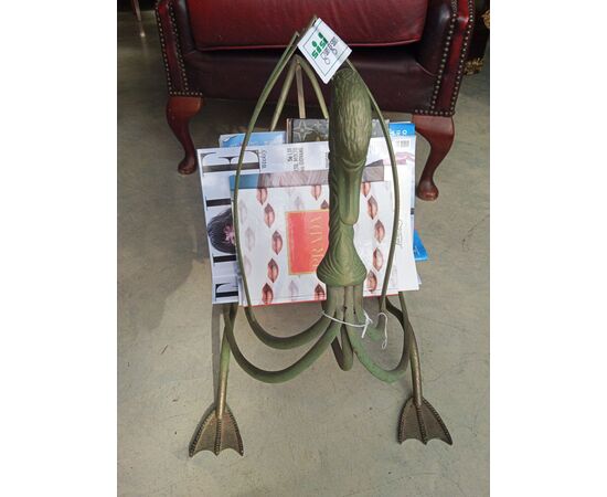 Painted metal log holder in the shape of a swan