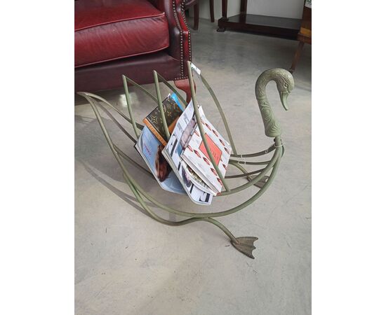 Painted metal log holder in the shape of a swan