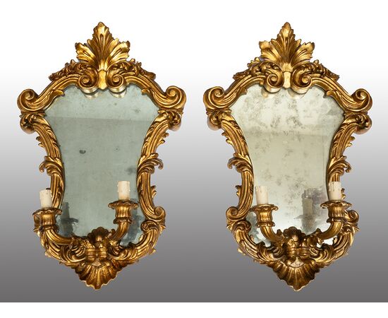 Pair of Louis XV style mirrors/sconces in gilded and carved wood. Venice, 19th century.