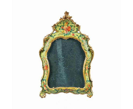 Carved, lacquered and painted wooden mirror. Venice, 18th century.