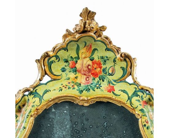 Carved, lacquered and painted wooden mirror. Venice, 18th century.