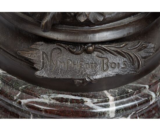 Antique patinated bronze sculpture depicting the "Nimphe de bois" signed "Louis Moreau" resting on a red Levanto marble base. France 19th century.
