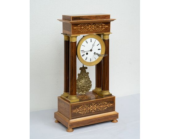 Antique Charles X clock in precious exotic woods. France, 19th century.