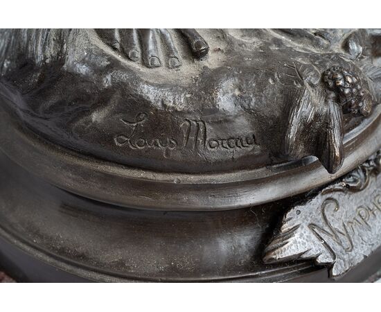Antique patinated bronze sculpture depicting the "Nimphe de bois" signed "Louis Moreau" resting on a red Levanto marble base. France 19th century.