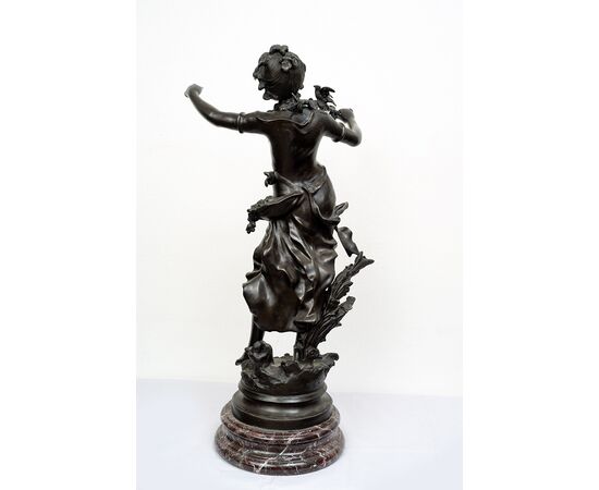 Antique patinated bronze sculpture depicting the "Nimphe de bois" signed "Louis Moreau" resting on a red Levanto marble base. France 19th century.