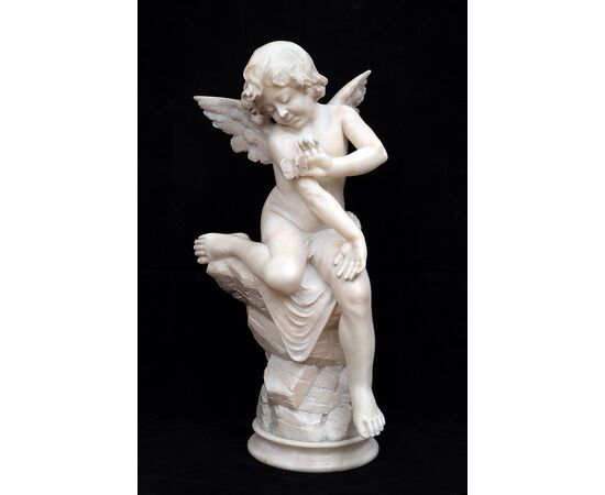 Antique alabaster sculpture of Napoleon III depicting a winged cherub. France, 19th century.