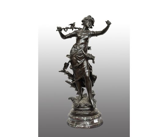 Antique patinated bronze sculpture depicting the "Nimphe de bois" signed "Louis Moreau" resting on a red Levanto marble base. France 19th century.