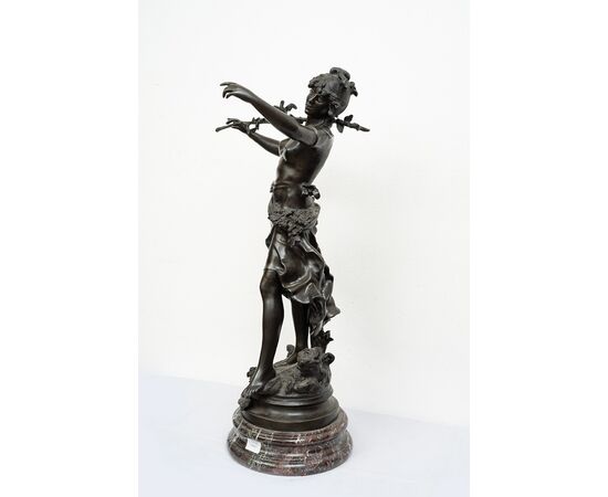 Antique patinated bronze sculpture depicting the "Nimphe de bois" signed "Louis Moreau" resting on a red Levanto marble base. France 19th century.
