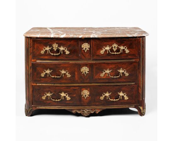 Louis XIV chest of drawers in rosewood, with chased and gilded bronze applications. Red marble top. France, early 18th century.