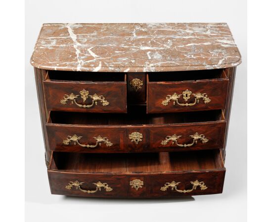 Louis XIV chest of drawers in rosewood, with chased and gilded bronze applications. Red marble top. France, early 18th century.