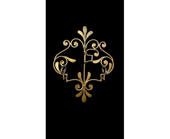 Wrought iron and gilded coat rack wall light.