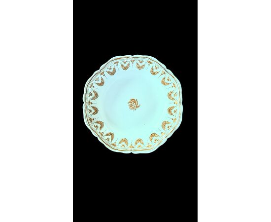 Four majolica plates decorated with festoons and floral motifs. Moustiers, France. Signature Jean Etienne Baron. Olerys and Laugier manufactory.