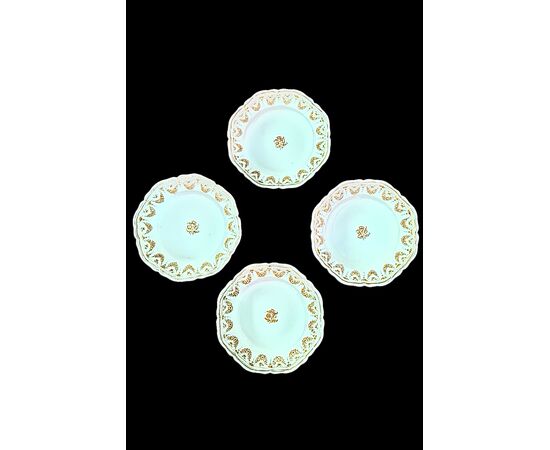 Four majolica plates decorated with festoons and floral motifs. Moustiers, France. Signature Jean Etienne Baron. Olerys and Laugier manufactory.