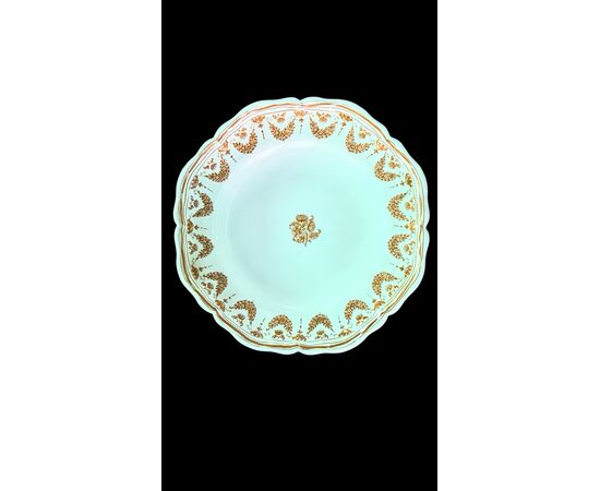 Four majolica plates decorated with festoons and floral motifs. Moustiers, France. Signature Jean Etienne Baron. Olerys and Laugier manufactory.