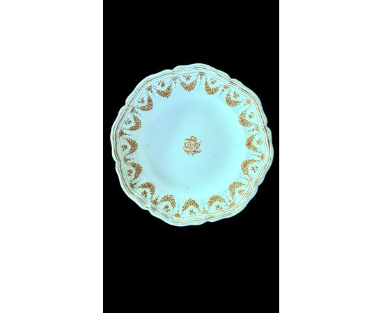 Four majolica plates decorated with festoons and floral motifs. Moustiers, France. Signature Jean Etienne Baron. Olerys and Laugier manufactory.