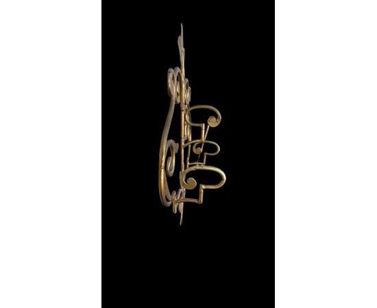 Wrought iron and gilded coat rack wall light.