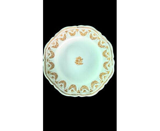 Four majolica plates decorated with festoons and floral motifs. Moustiers, France. Signature Jean Etienne Baron. Olerys and Laugier manufactory.