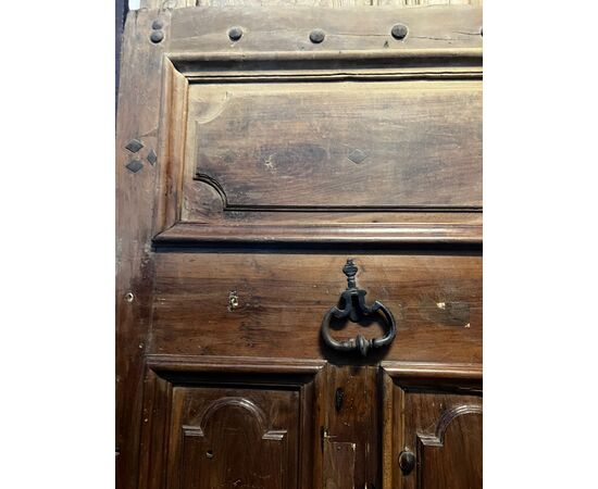 PTCI474 - Studded small door, with sculpted panels, in walnut wood, 18th century, measurements cm W 114 x H 238
