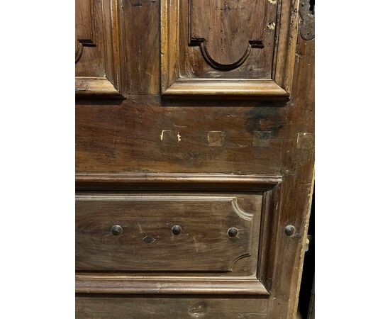 PTCI474 - Studded small door, with sculpted panels, in walnut wood, 18th century, measurements cm W 114 x H 238