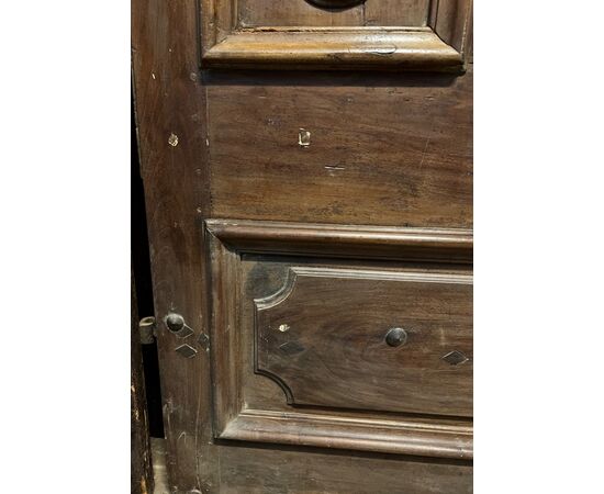 PTCI474 - Studded small door, with sculpted panels, in walnut wood, 18th century, measurements cm W 114 x H 238