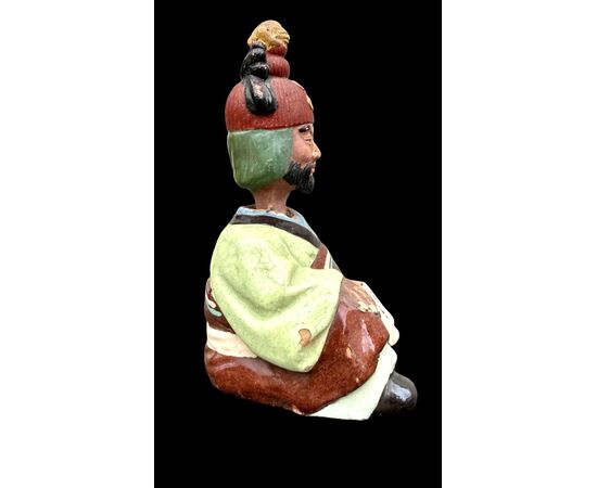 Ceramic figure depicting a Japanese character. Articulated head.
