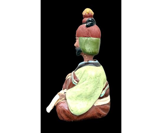 Ceramic figure depicting a Japanese character. Articulated head.
