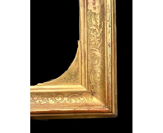 Carved wooden mirror-frame.