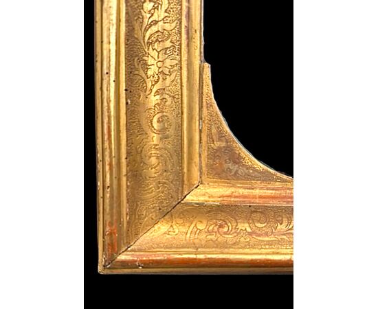 Carved wooden mirror-frame.